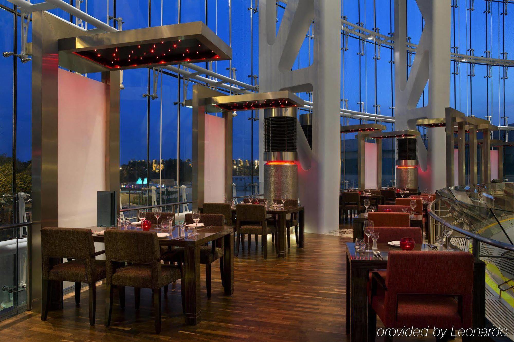 אבו דאבי Millennium Al Rawdah Hotel מראה חיצוני תמונה The interior of the restaurant